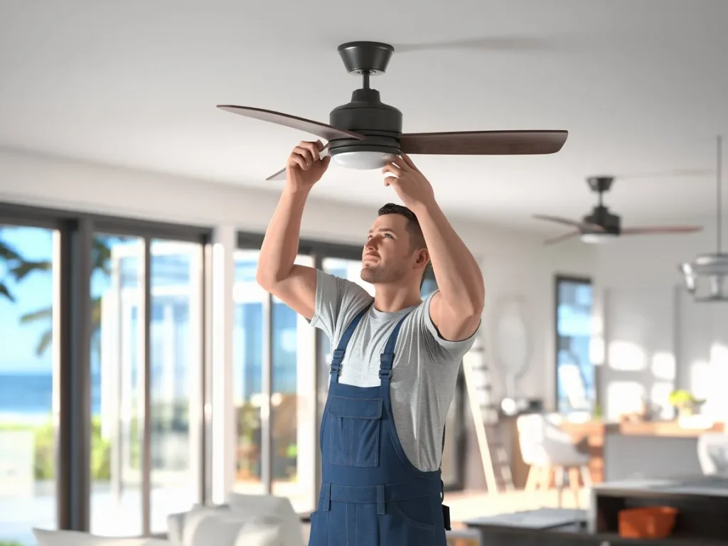 Ceiling fan installation by an electrician in Moffat Beach, ensuring proper wiring and safety.